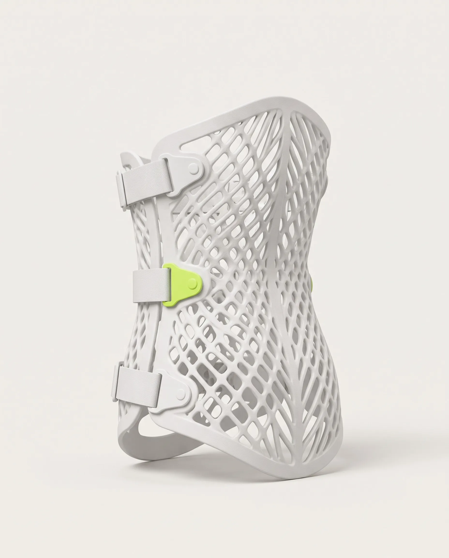 3D-printed TLSO body brace with white lattice structure, straps and green buckles